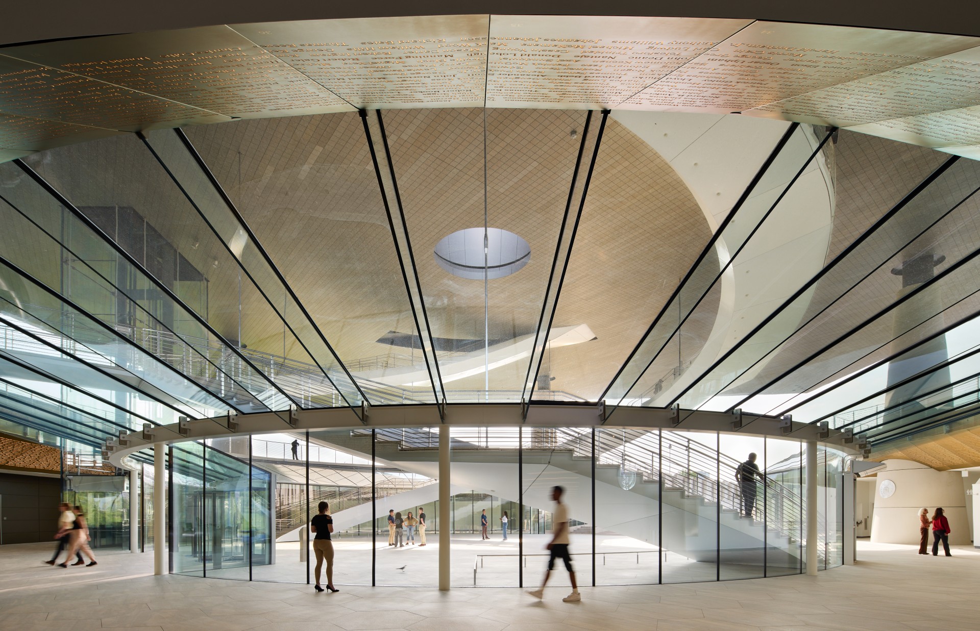 people walking in a glass building with Pulkovo Airport in the background