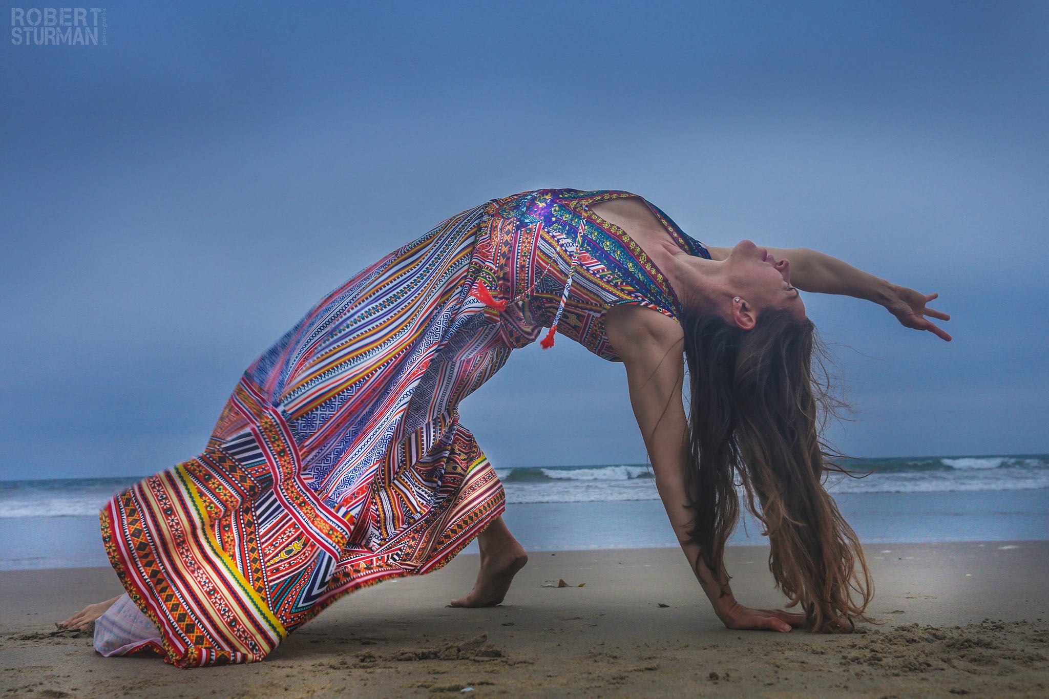 a woman in a dress on a beach