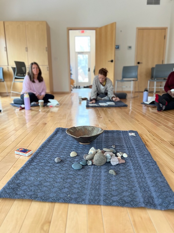 a group of people sitting on the floor