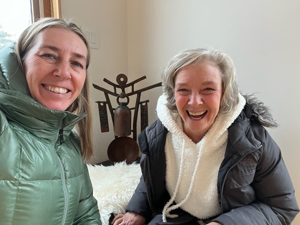 two women smiling at the camera