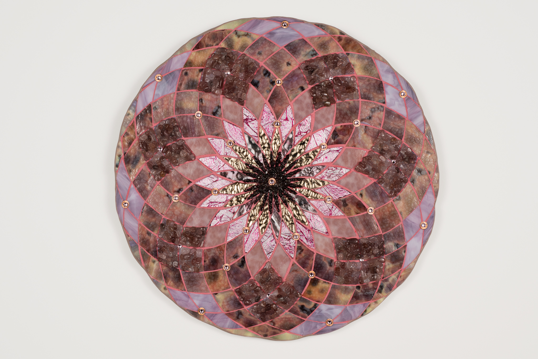 a circular object with a flower design