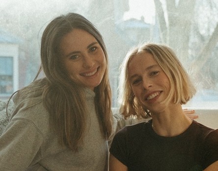 a couple of women smiling