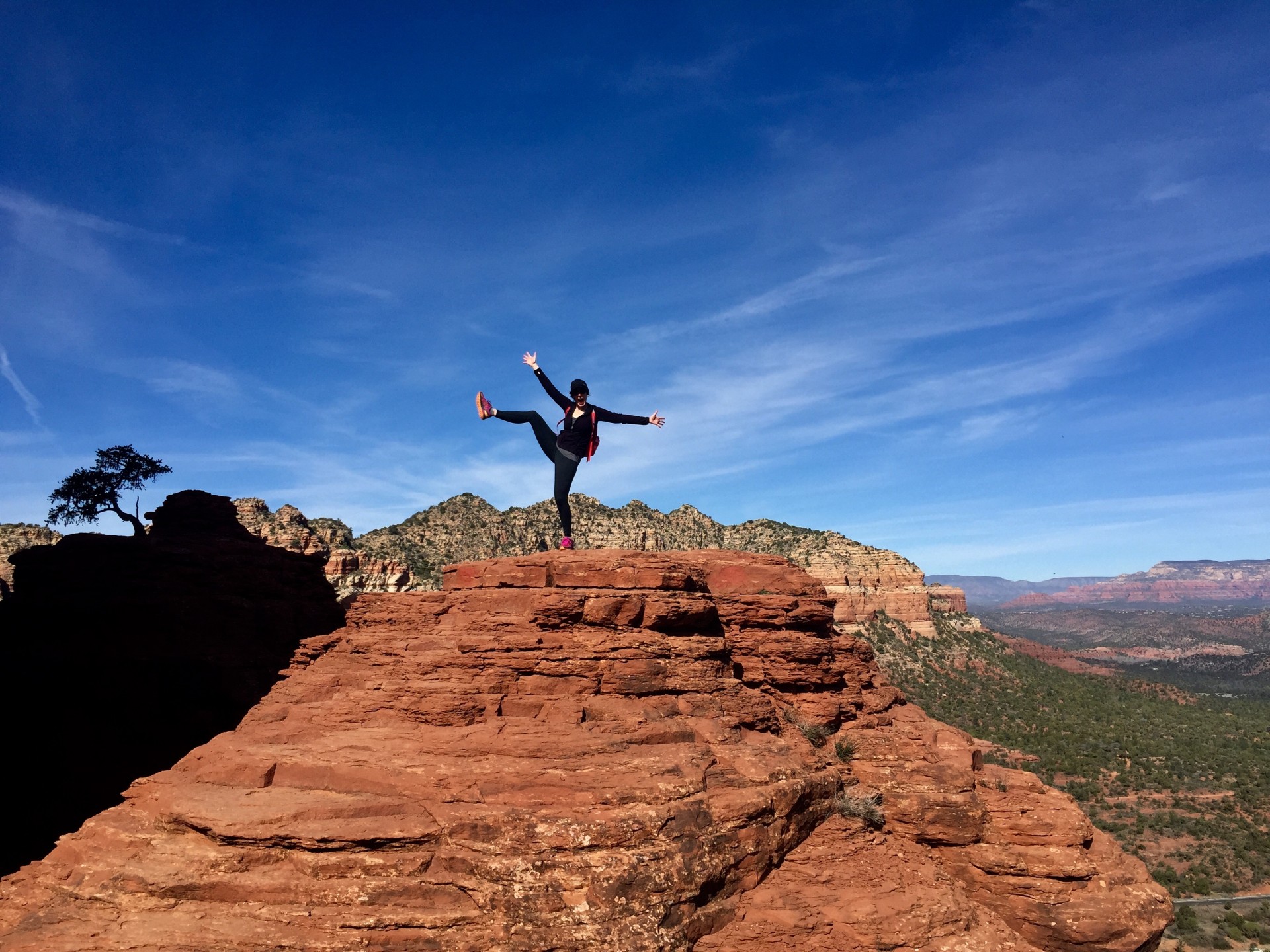 a person standing on a rock