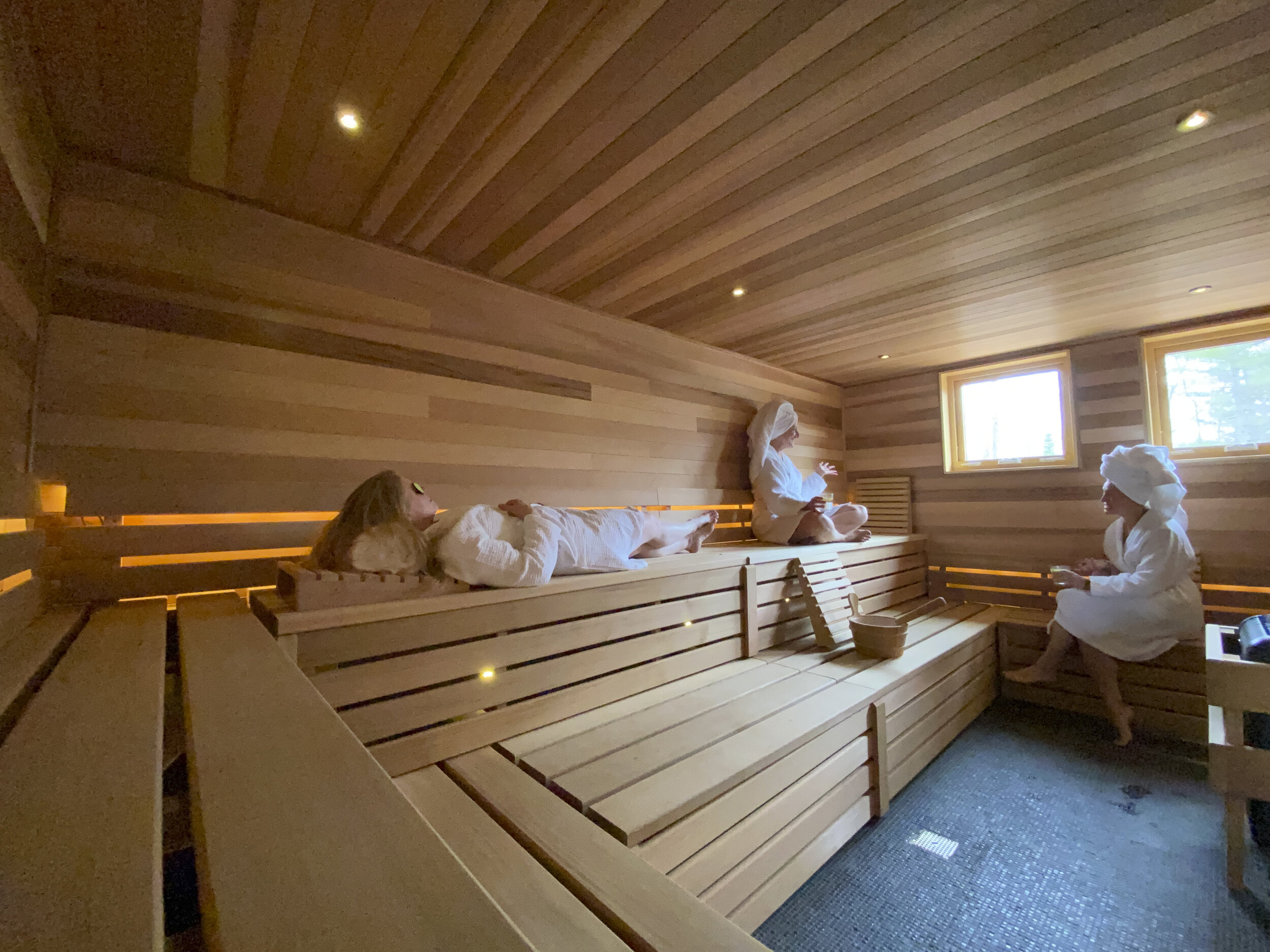 a group of people in a sauna