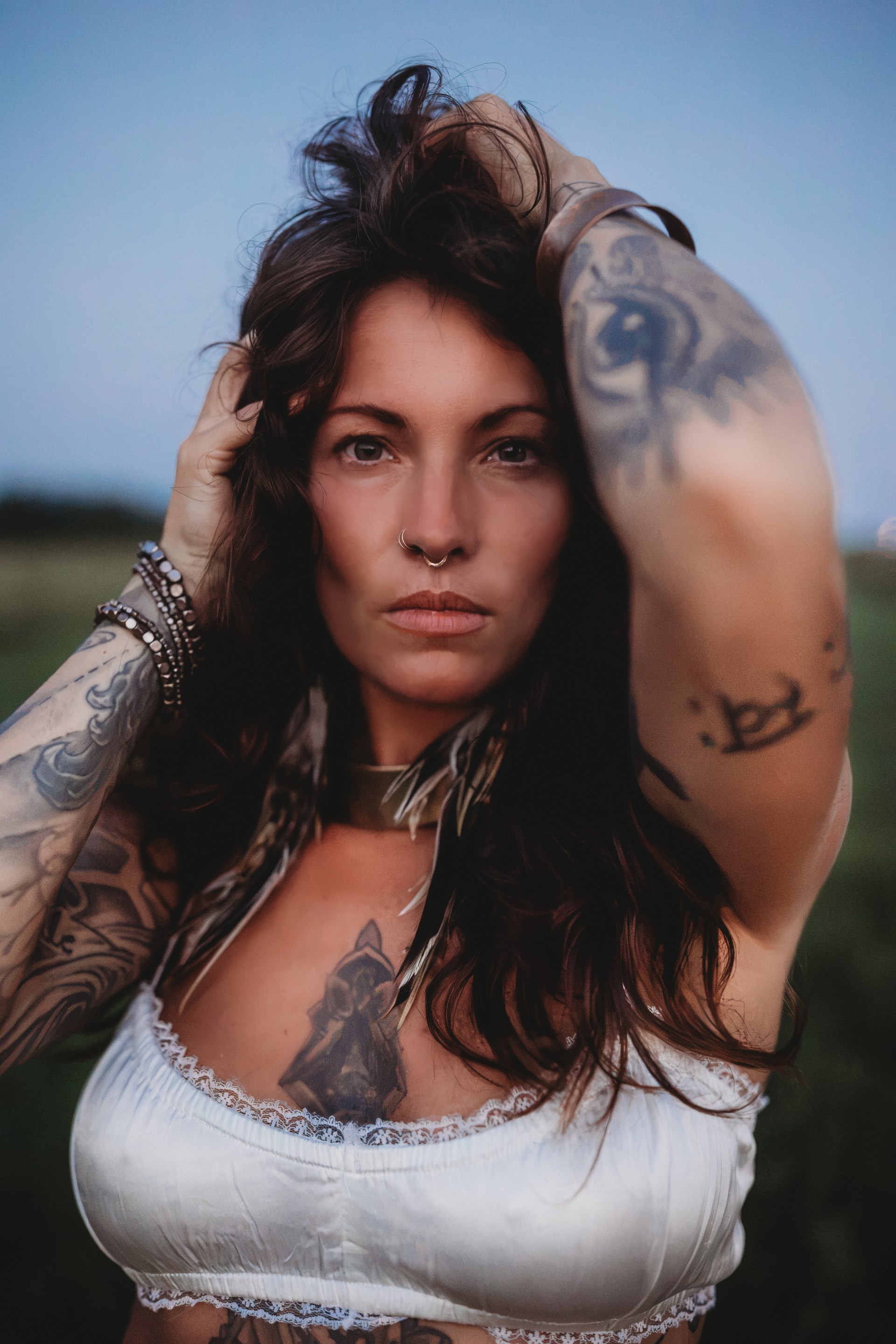 a woman with tattoos on her arm