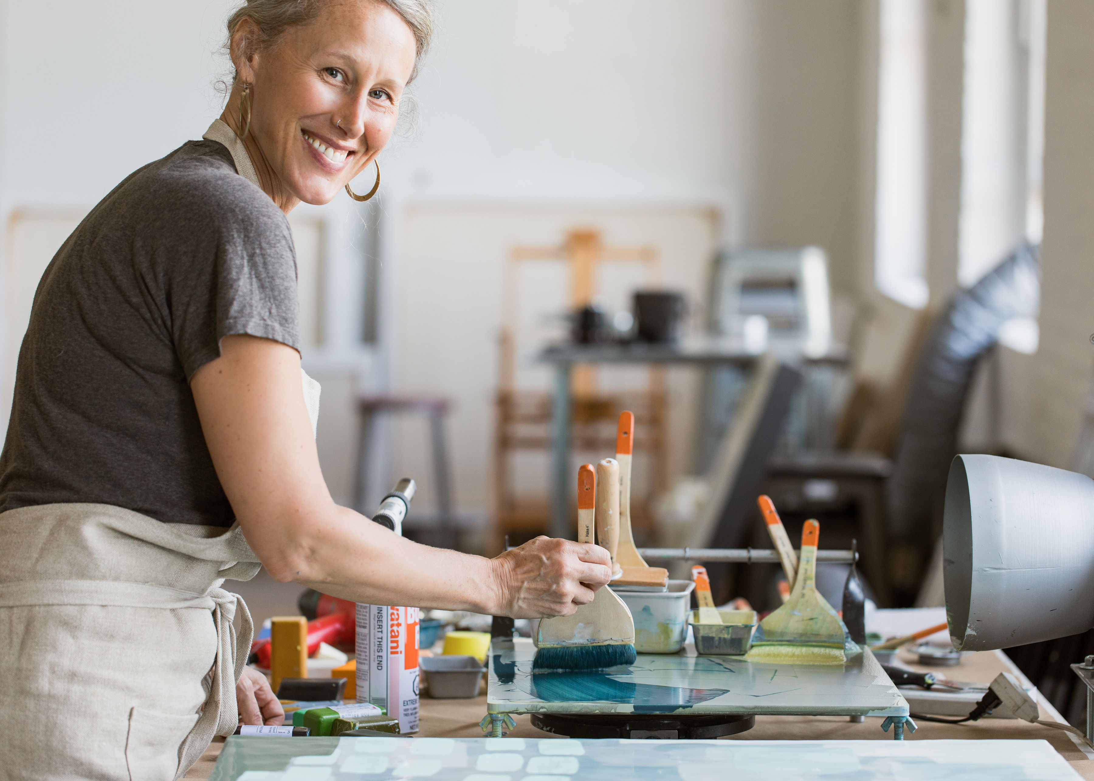a woman painting a table