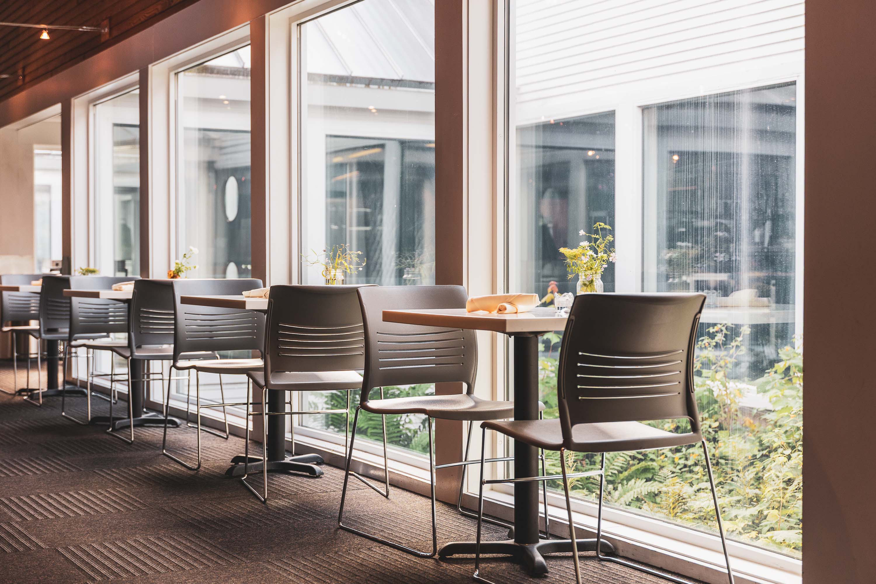 a room with tables and chairs
