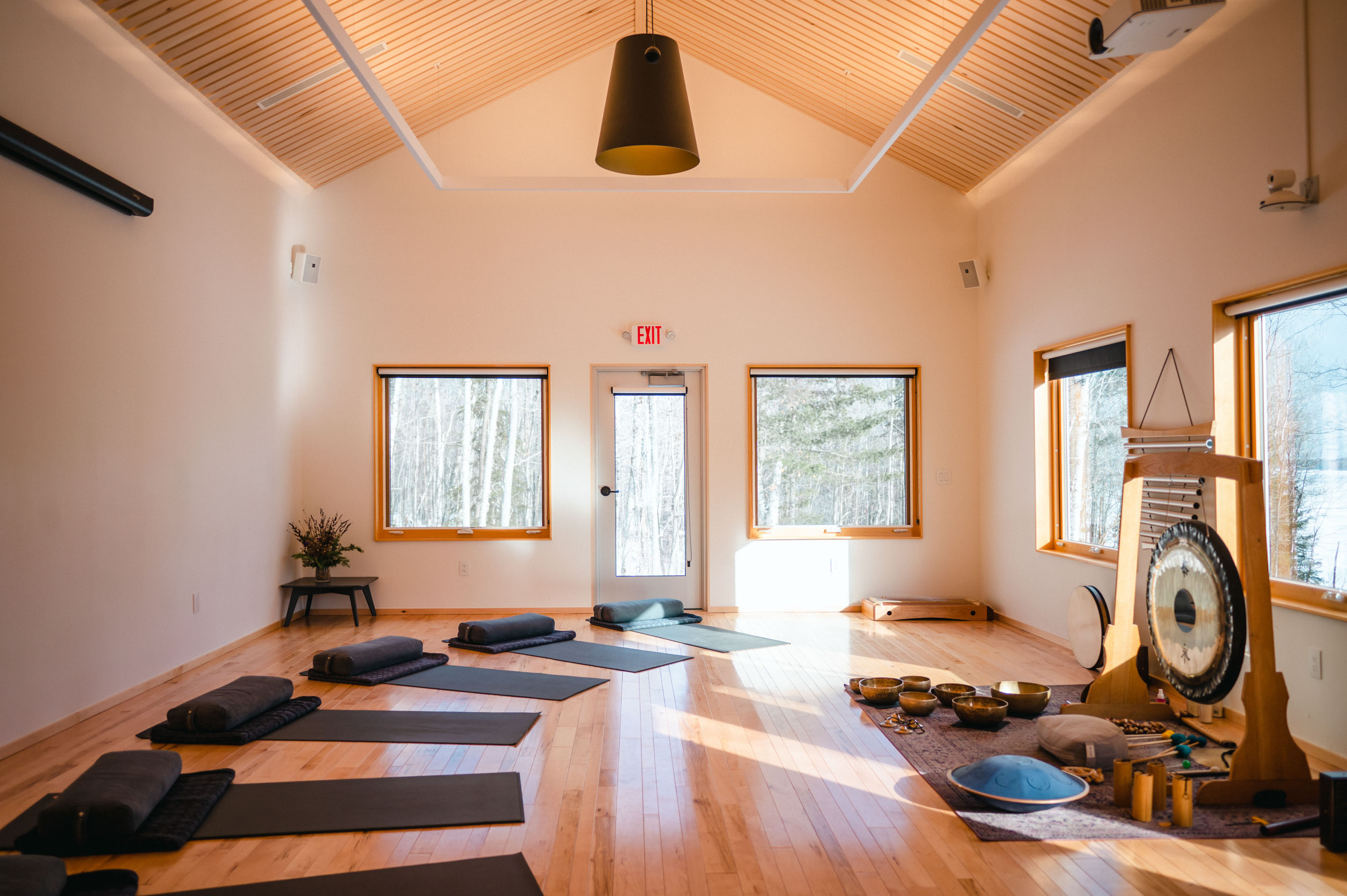 a room with mats and bowls on mats