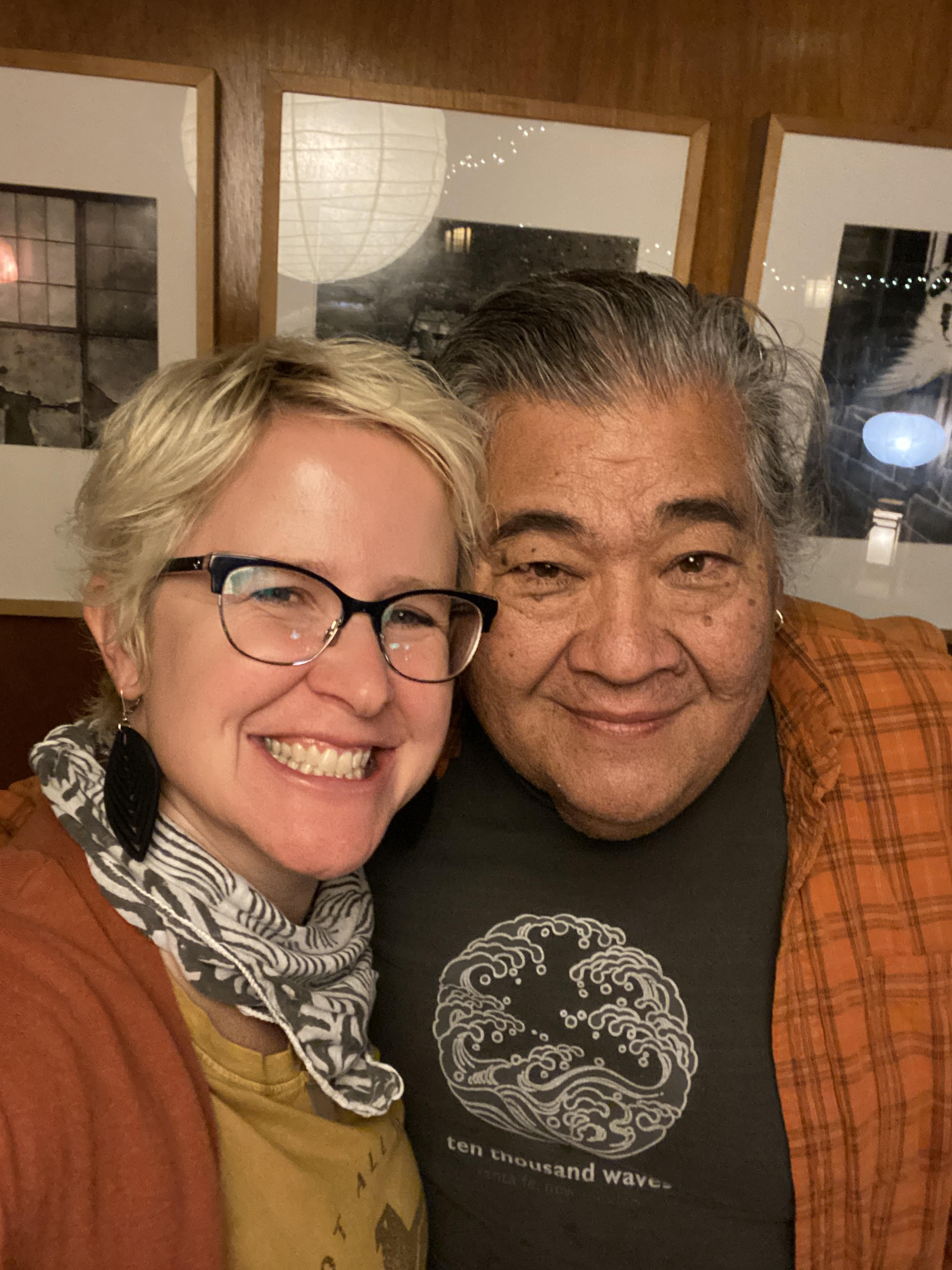 a woman smiling next to a man