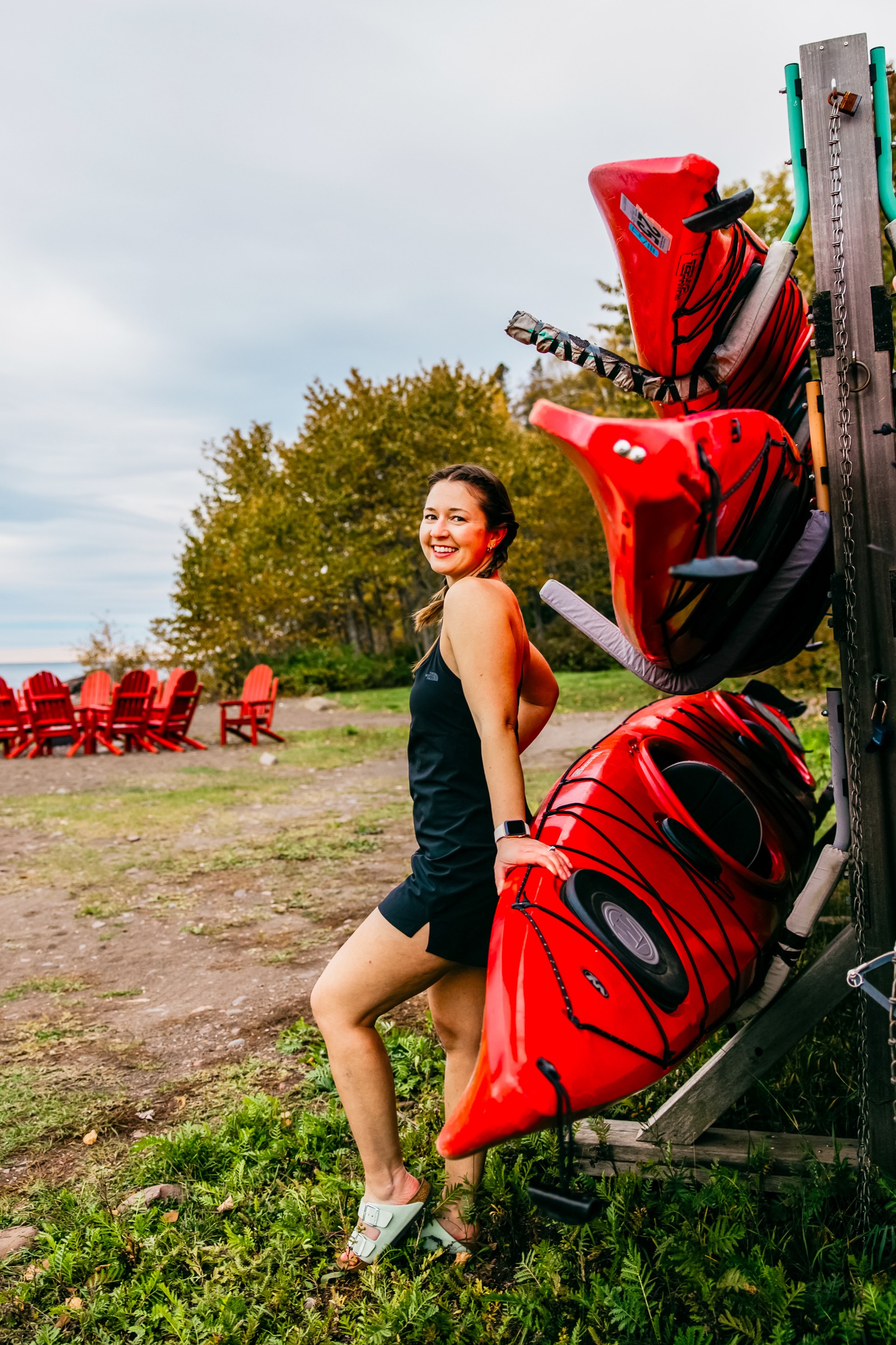 a woman holding a kayak