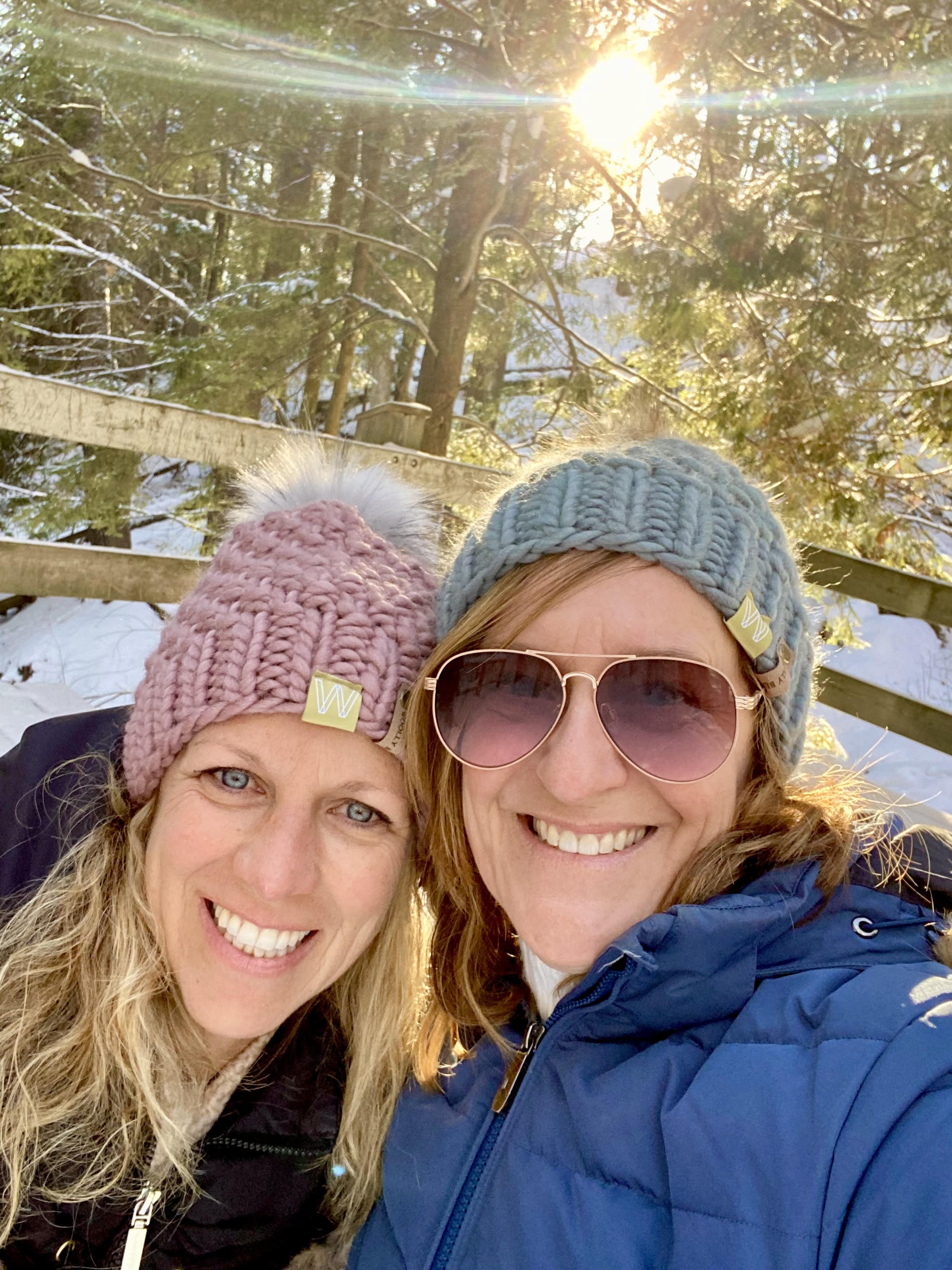 two women taking a selfie in the snow