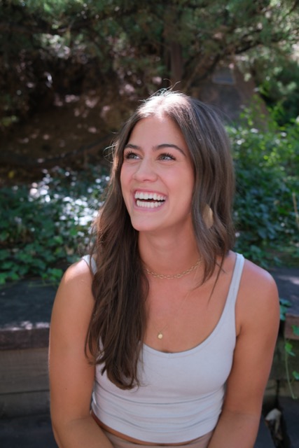 a woman smiling with long hair