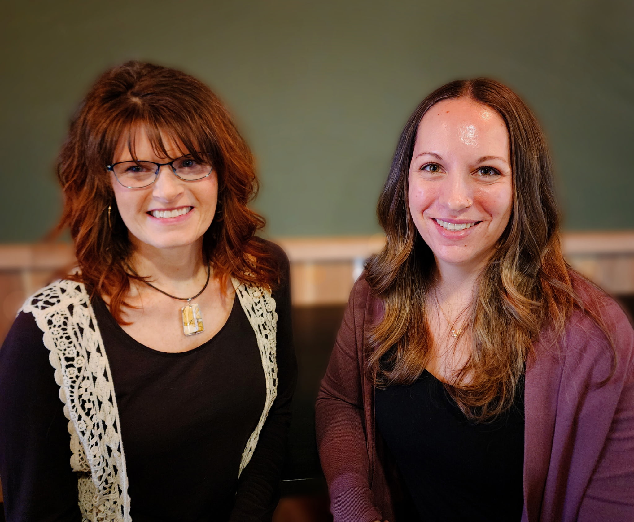 two women smiling at the camera