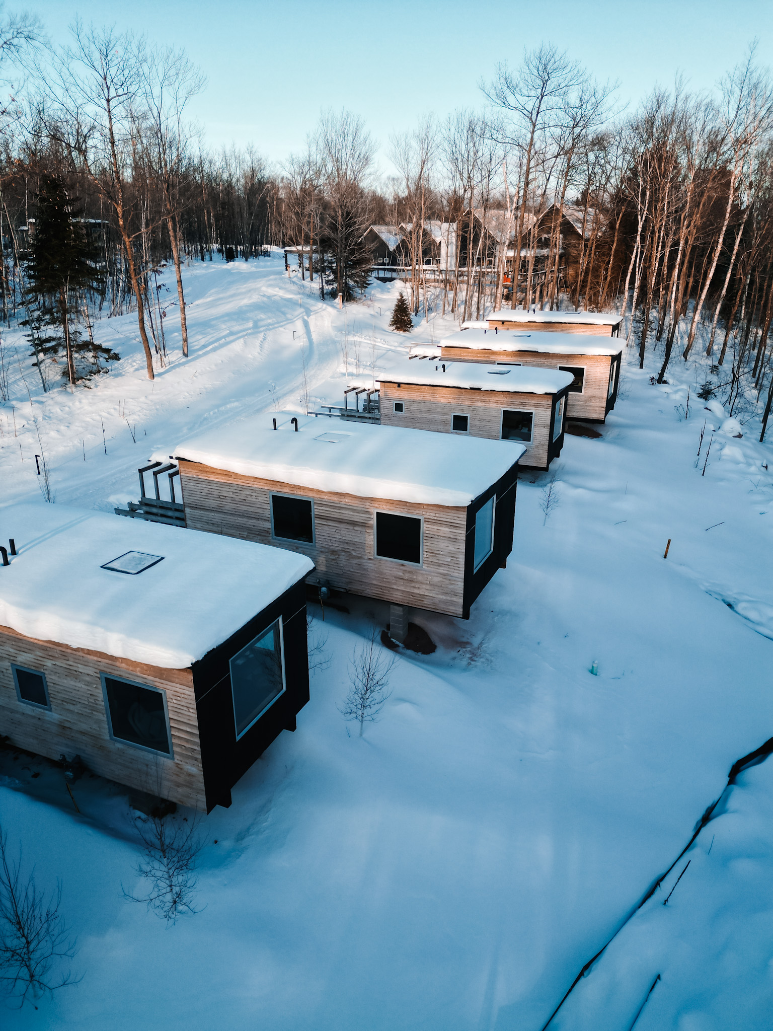 a group of houses in the snow