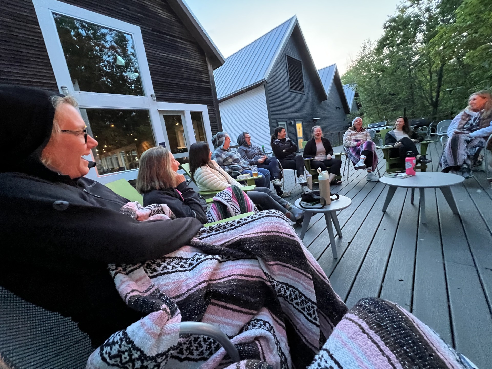 a group of people sitting on a deck