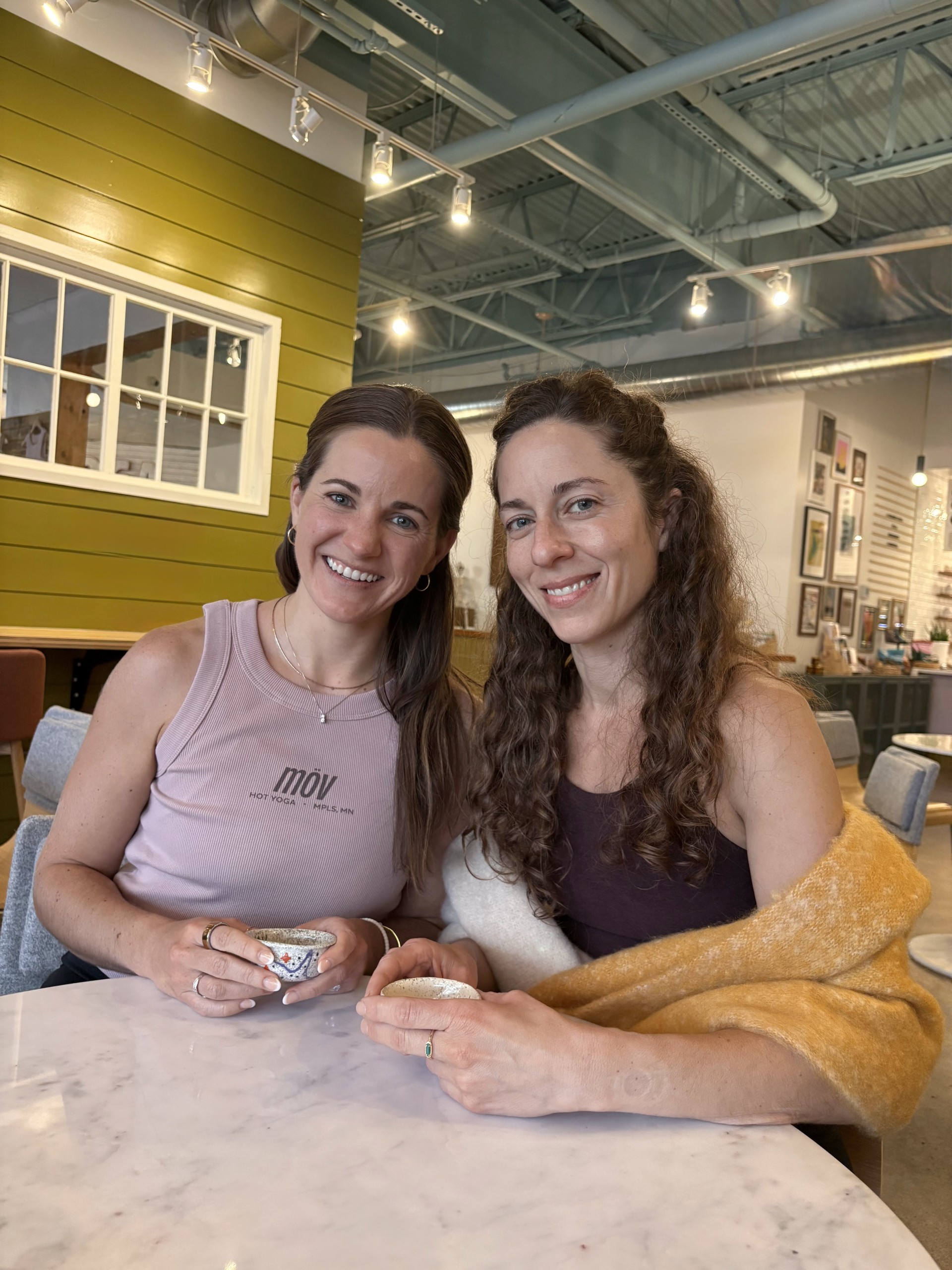 two women sitting at a table