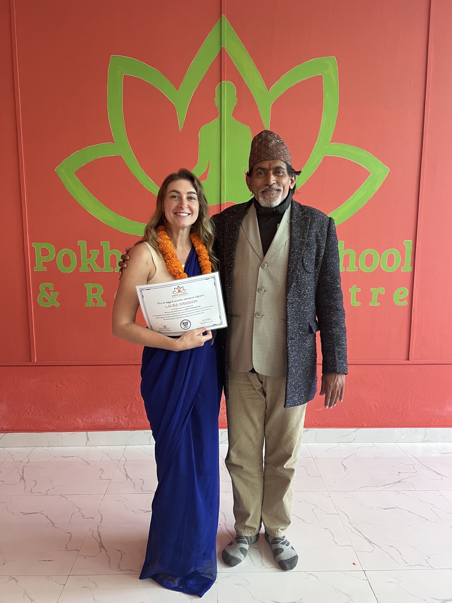 a woman holding a certificate and smiling