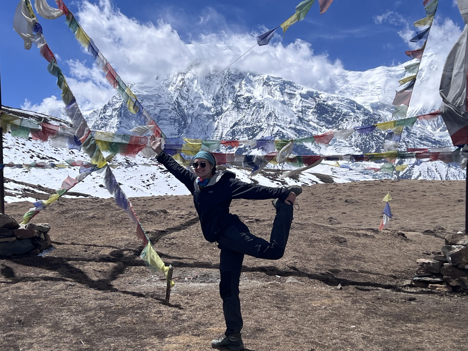 a woman standing in front of a flag