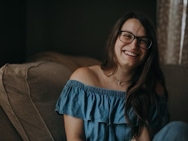 a woman smiling at camera