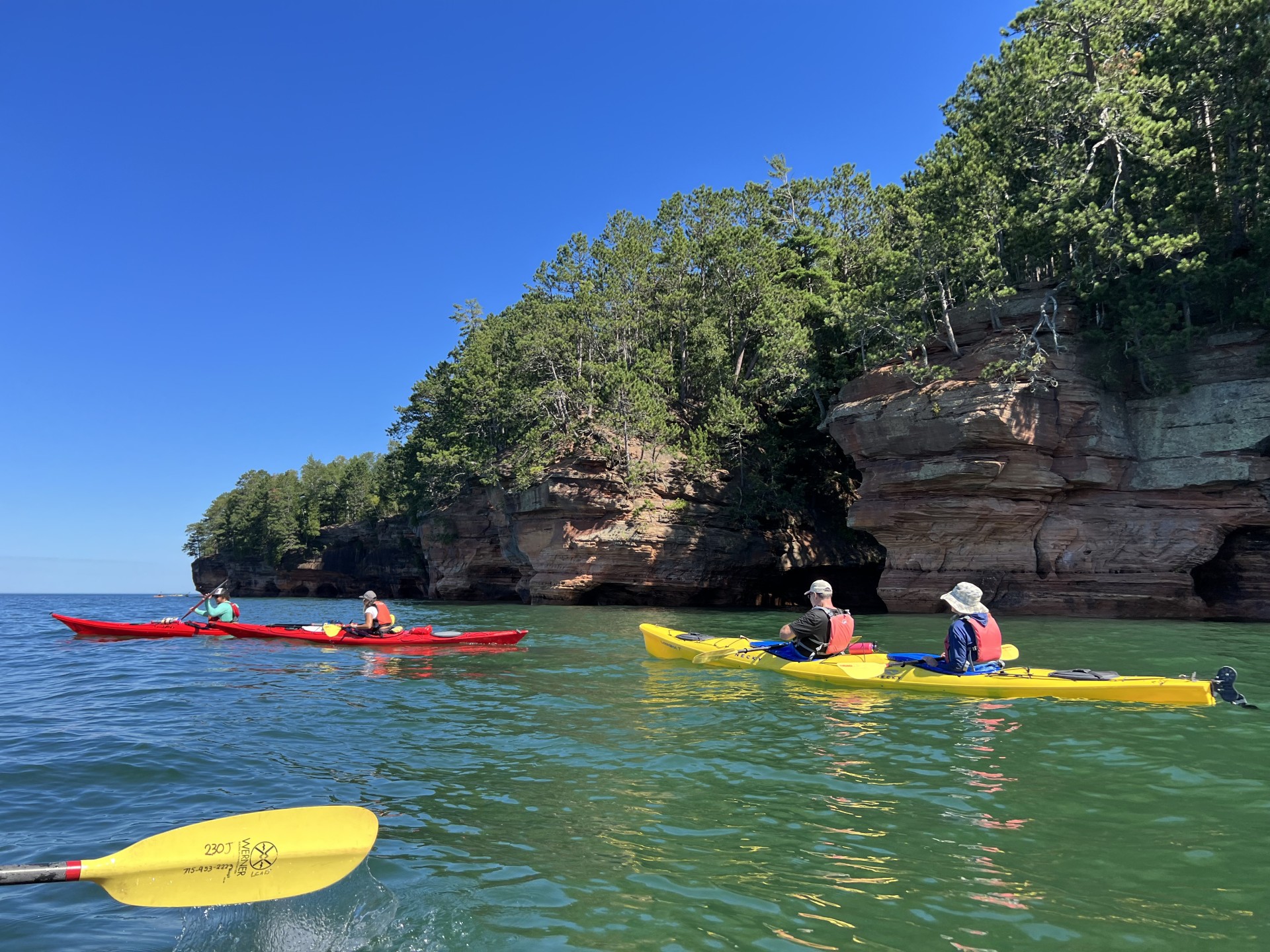 people kayaking on the water