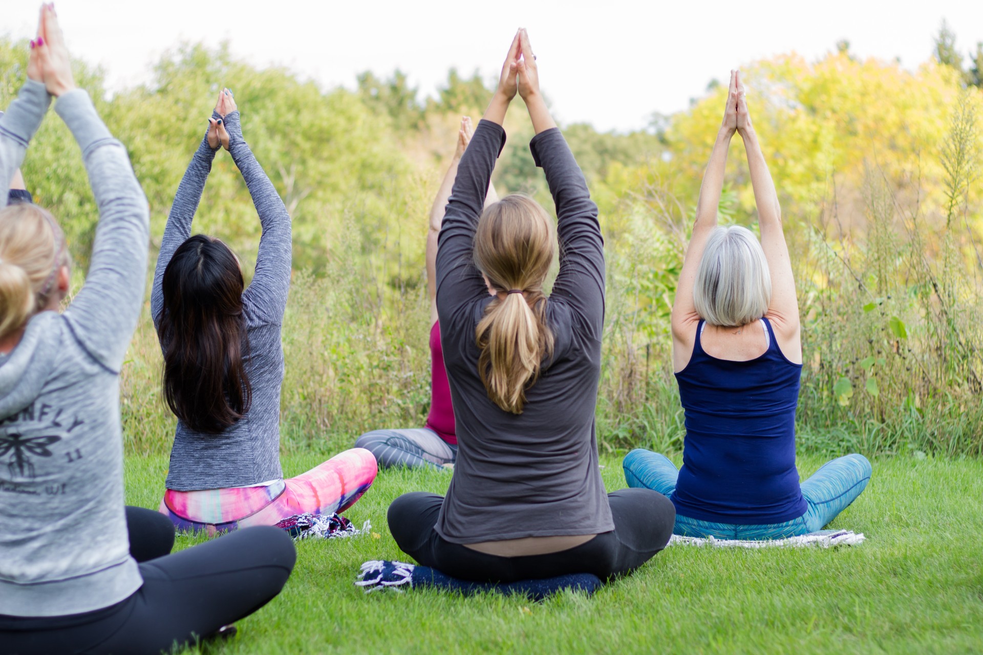 a group of women doing yoga