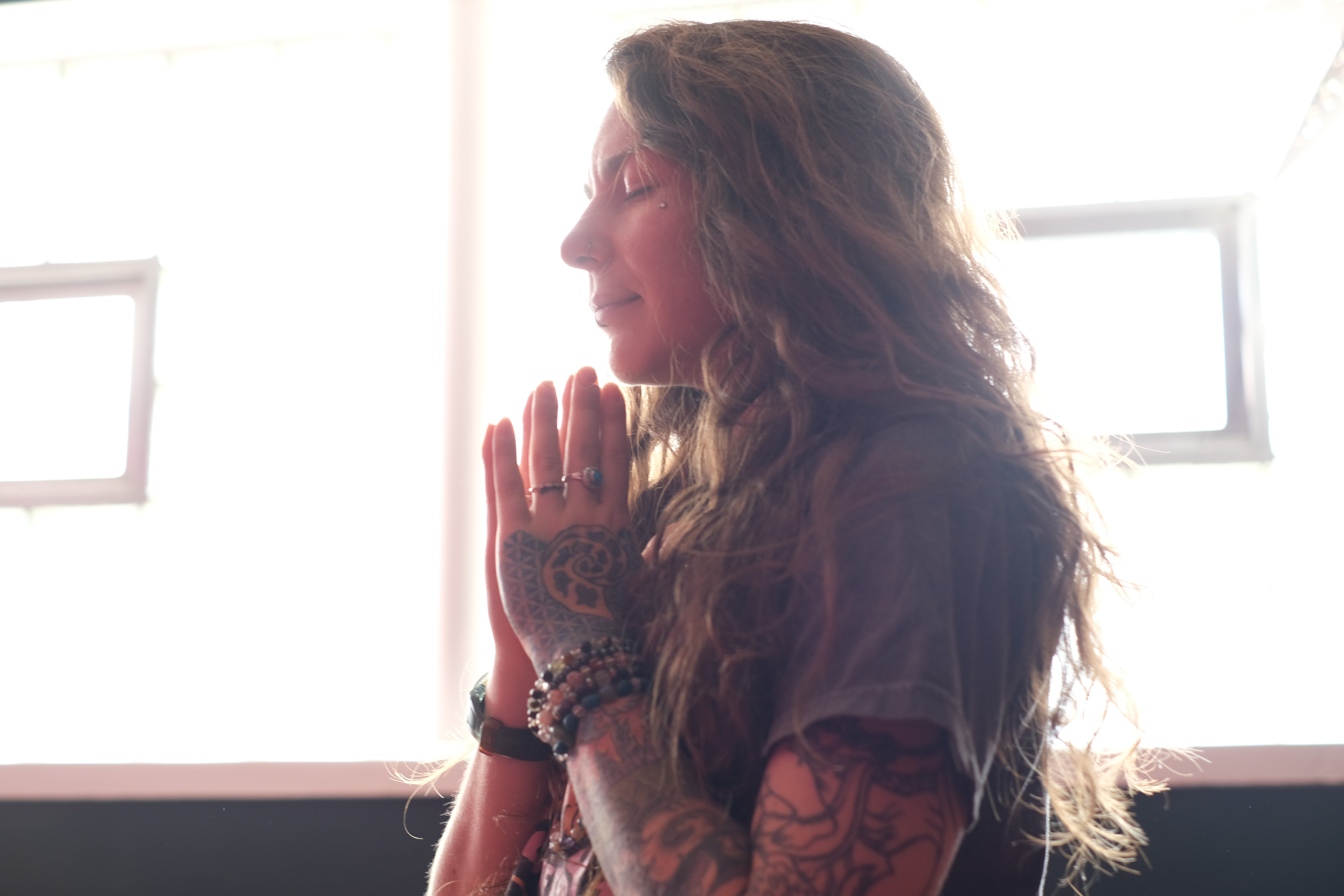 a woman with tattoos on her hands