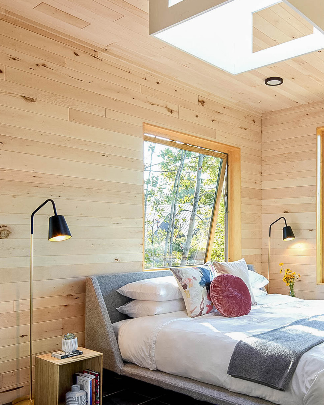 a bedroom with a bed and a window