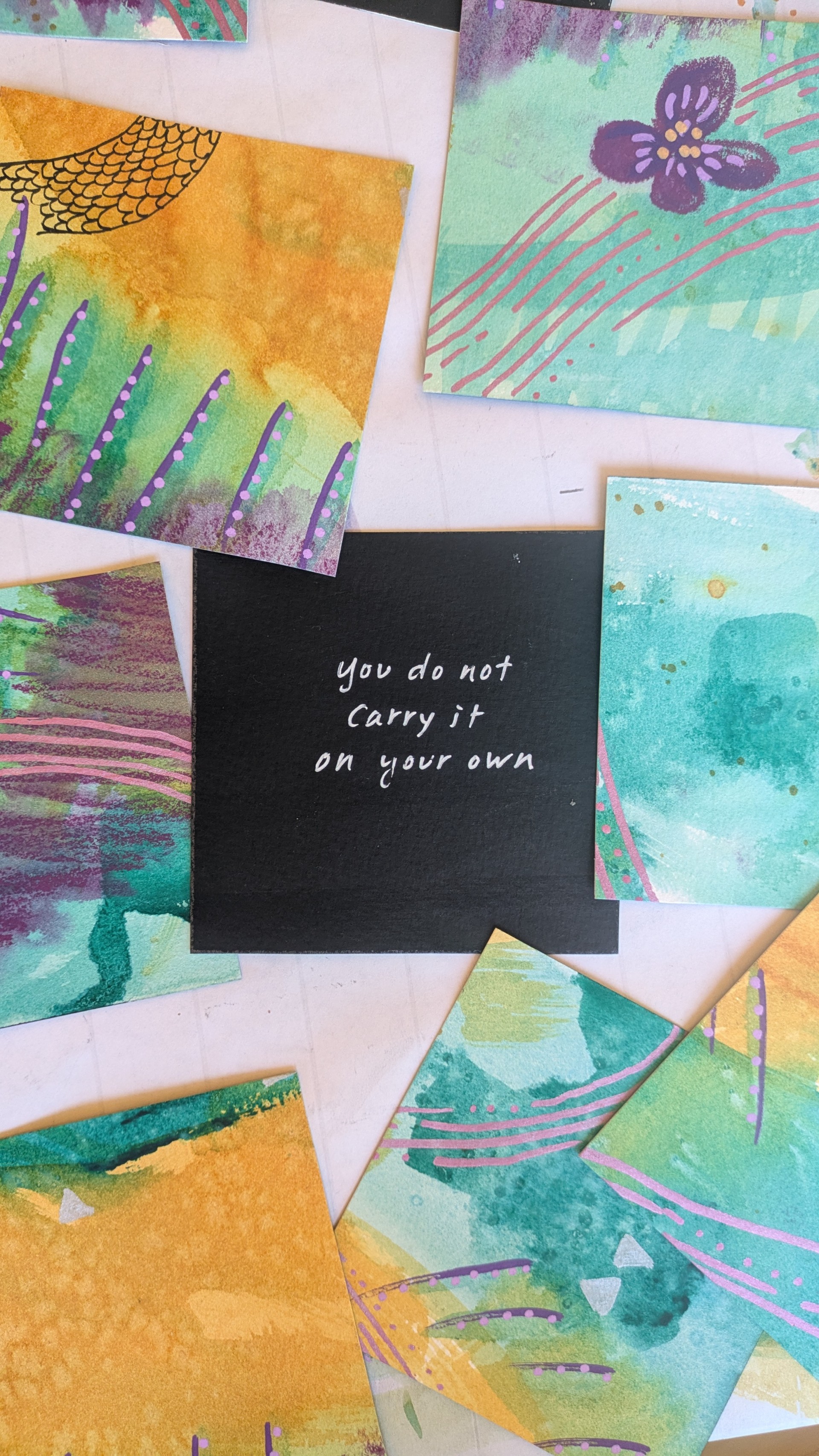 a black square with colorful art pieces on it