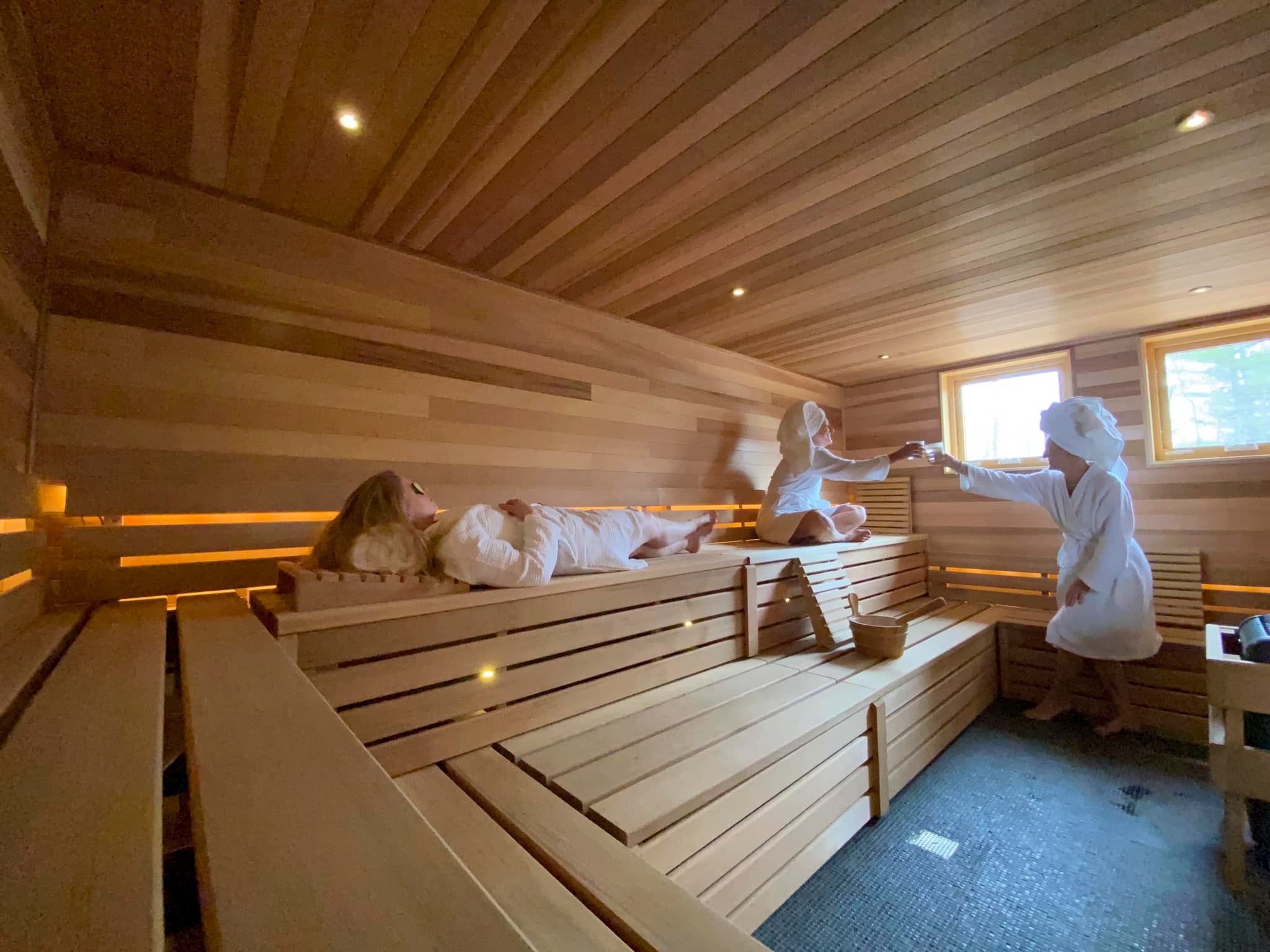 a group of people in a sauna