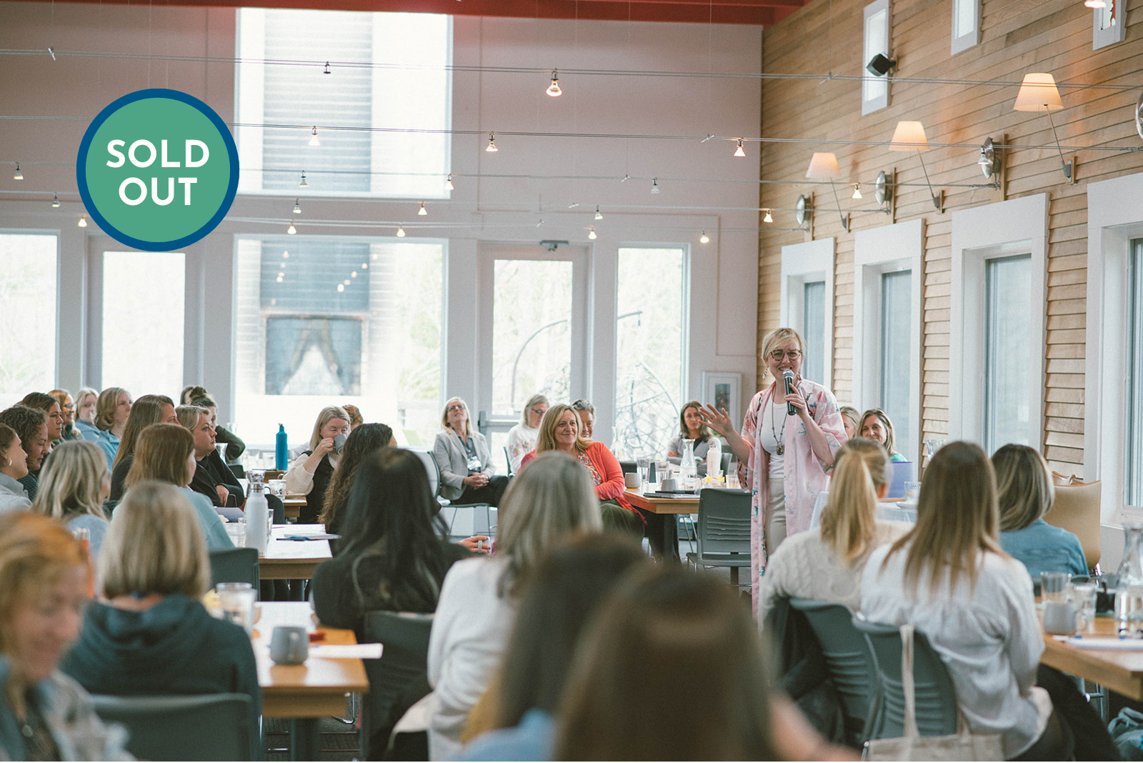 a woman speaking to a group of people