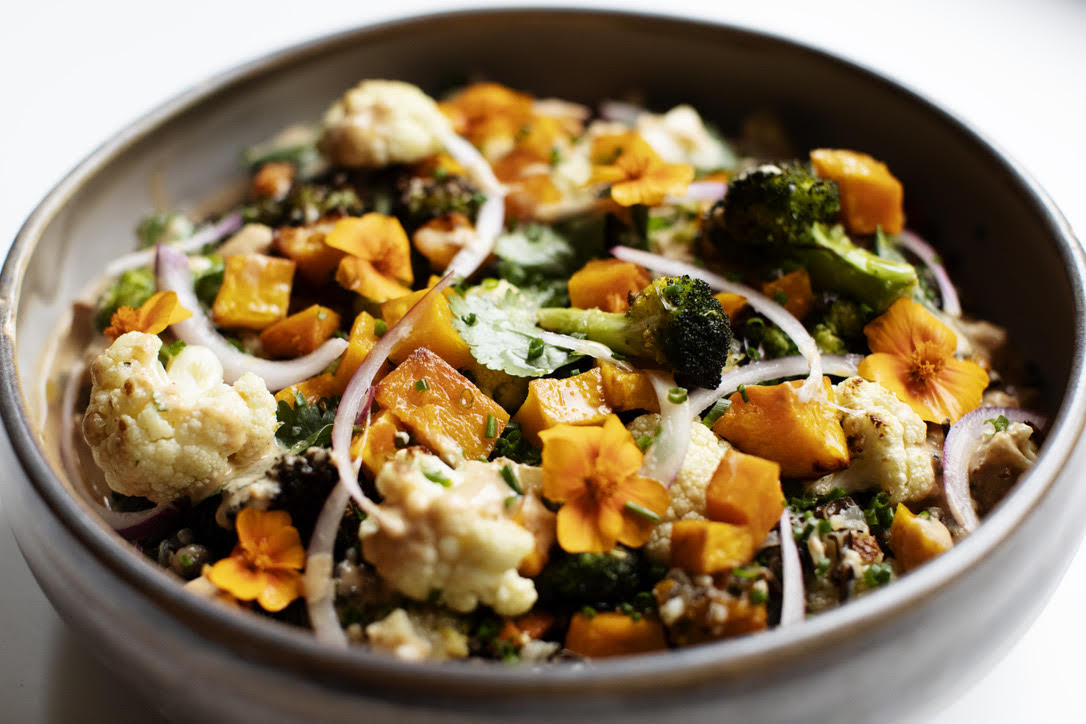 a bowl of food with flowers