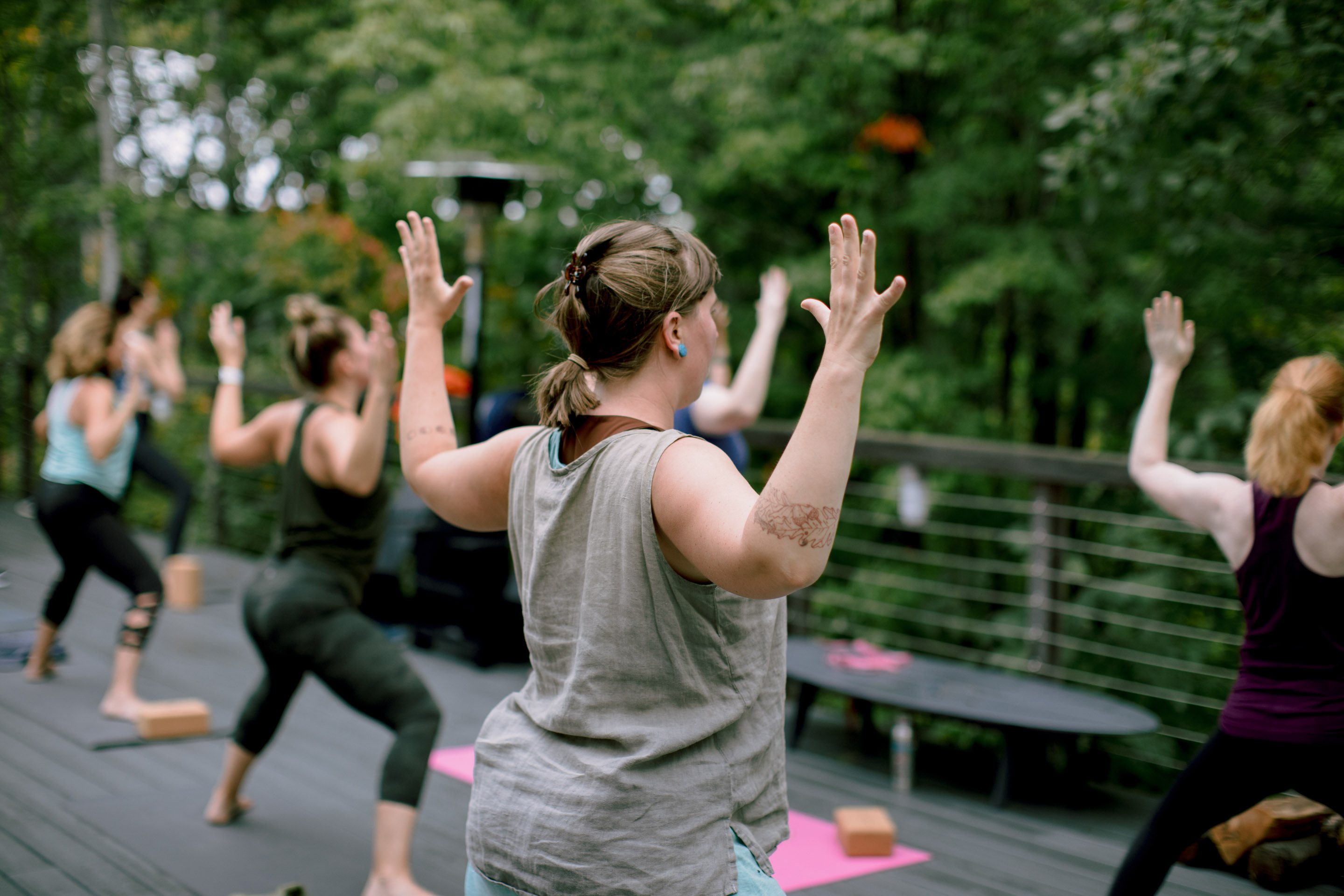 a group of women doing yoga outside