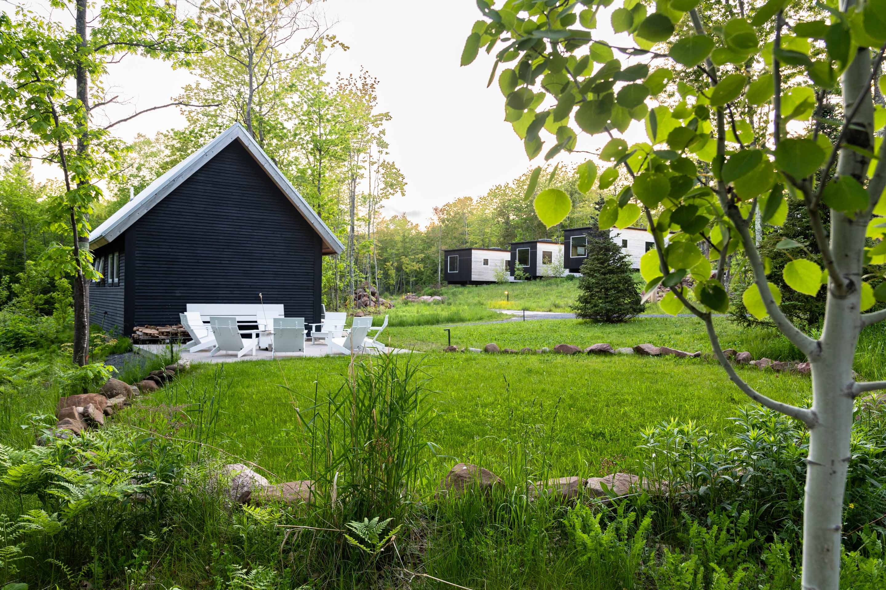 a house with a lawn and chairs