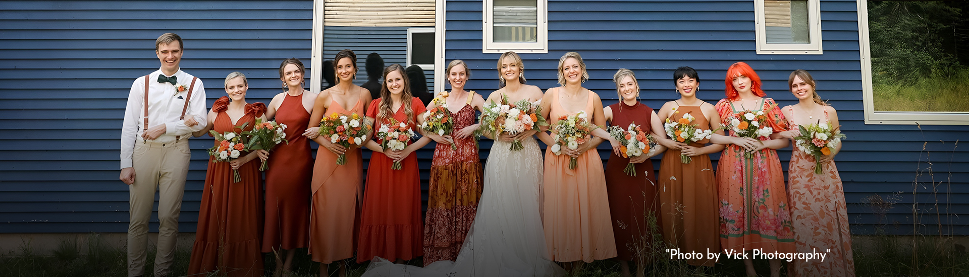 a group of women in dresses holding flowers