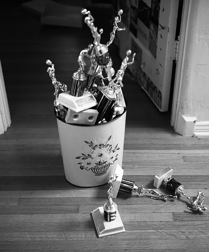 Black and white picture of a bucket full of trophies