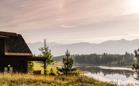 a house next to a lake