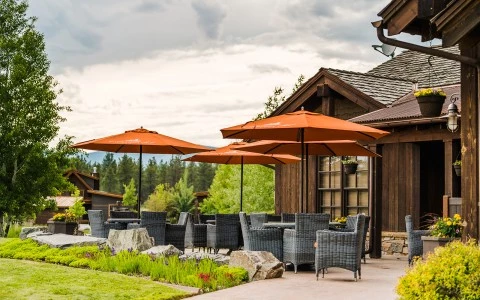 a patio with umbrellas and chairs