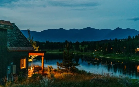 a house next to a lake