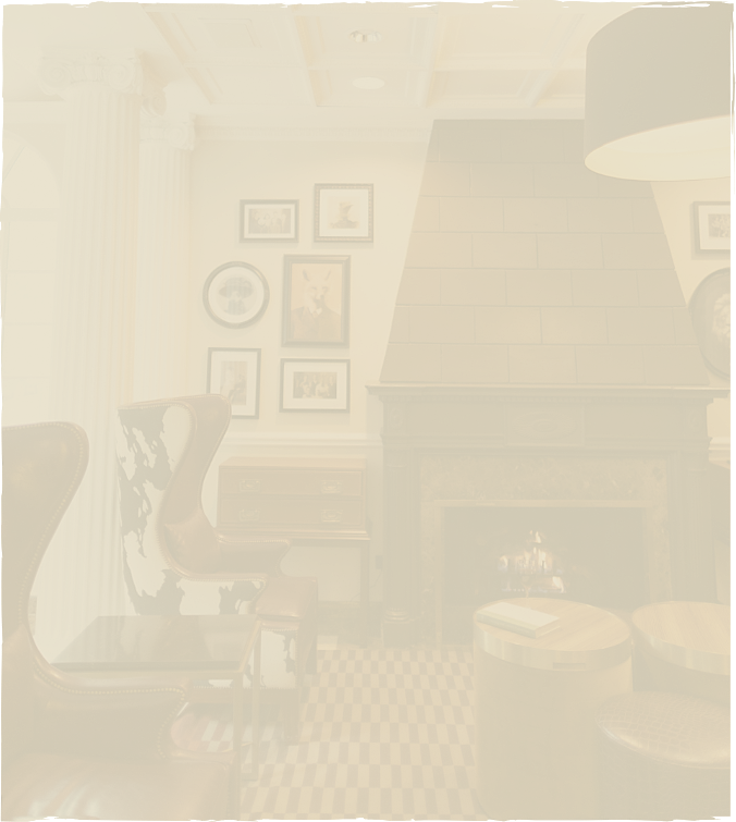 a room with a fireplace and chairs