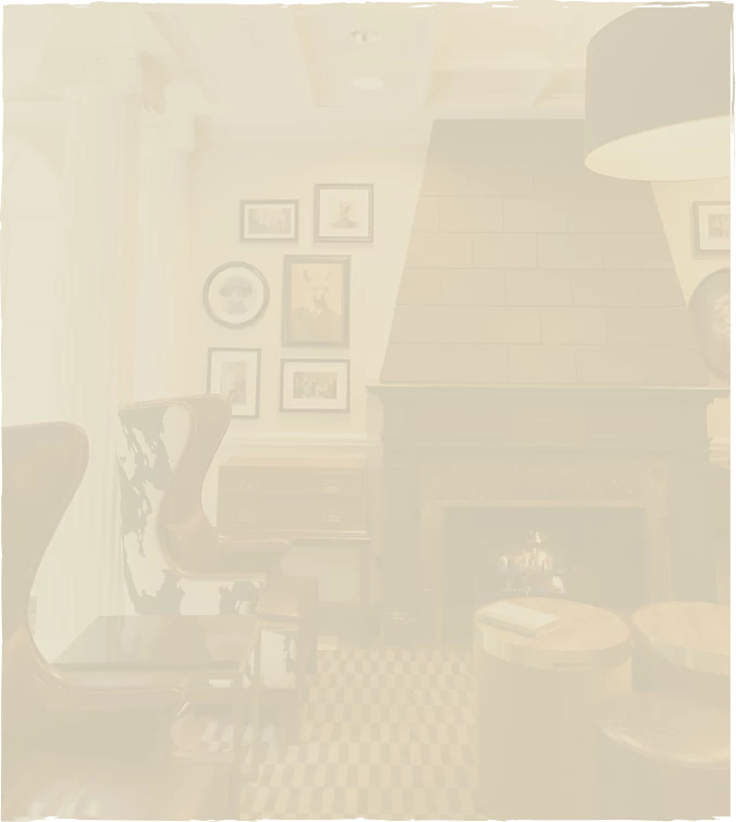 a room with a fireplace and chairs