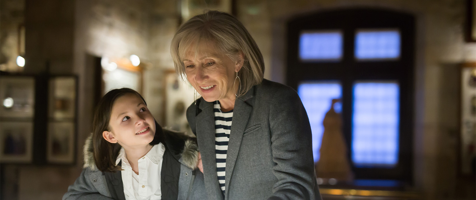 a woman and a girl smiling