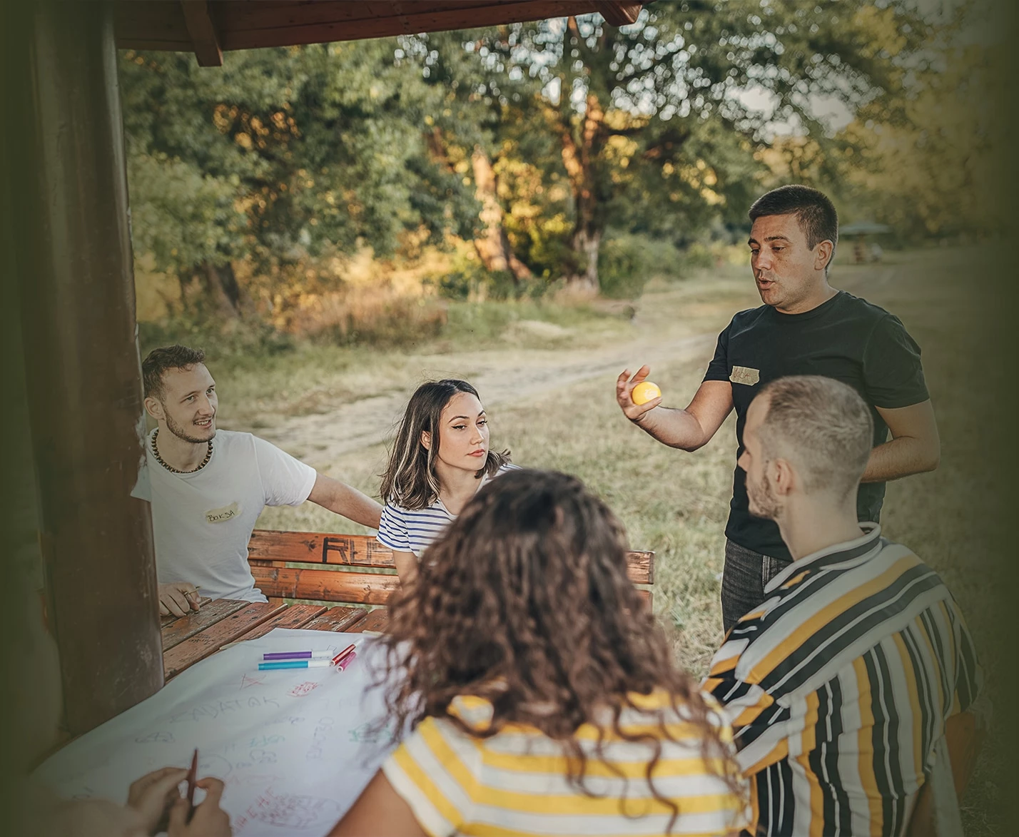 a group of people sitting outside