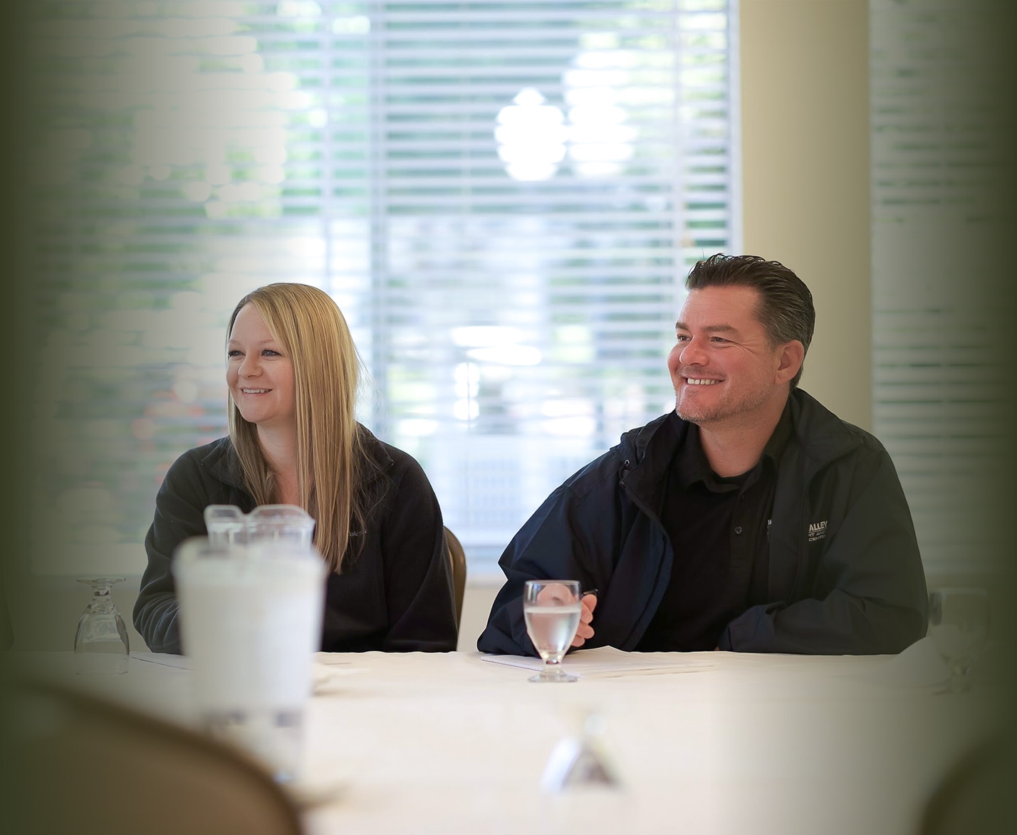 a man and a woman sitting at a table