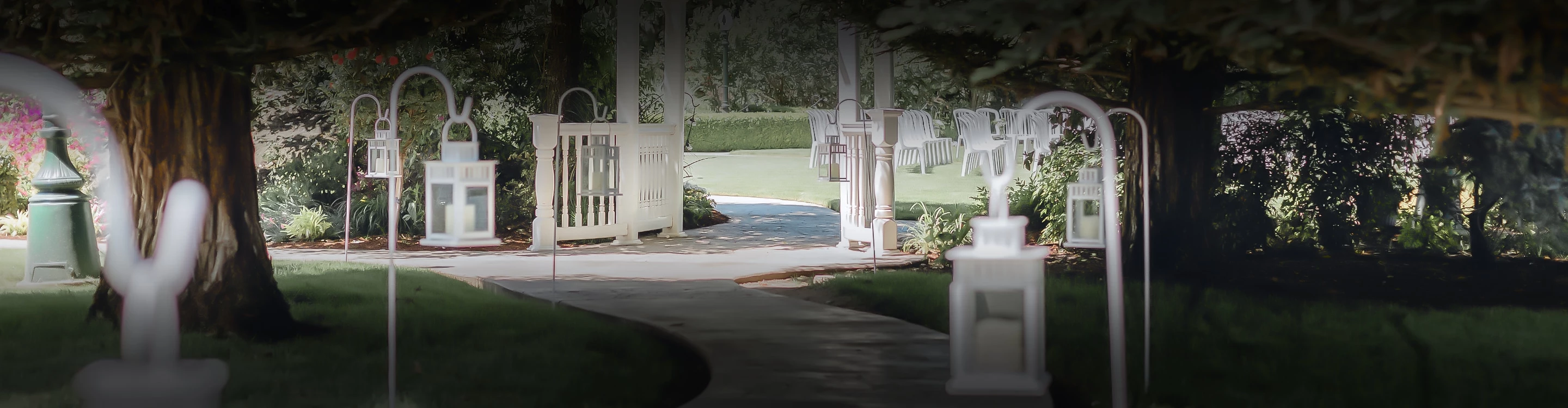 a white gate with a white arch