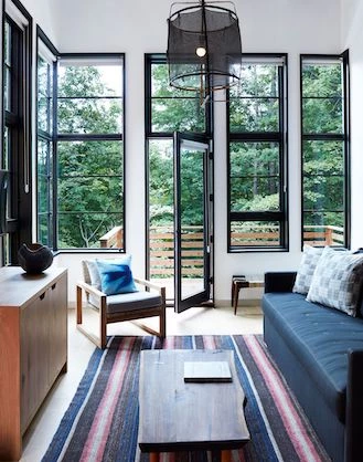 a living room with a large glass door