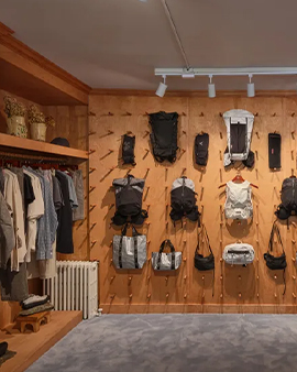 a room with clothes on the wall