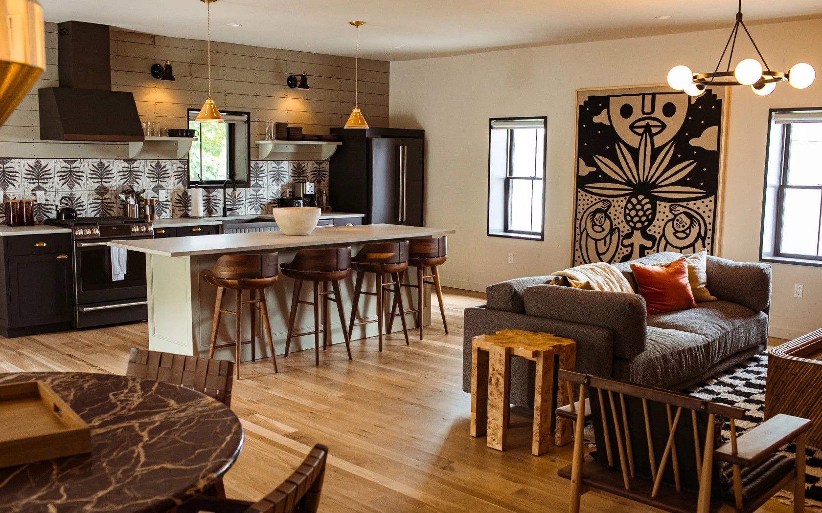 a kitchen with a bar and a couch