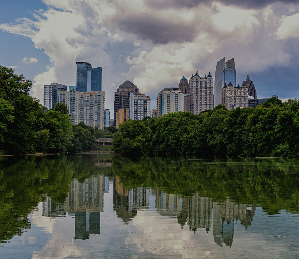 Piedmont Park skyline with trees and water