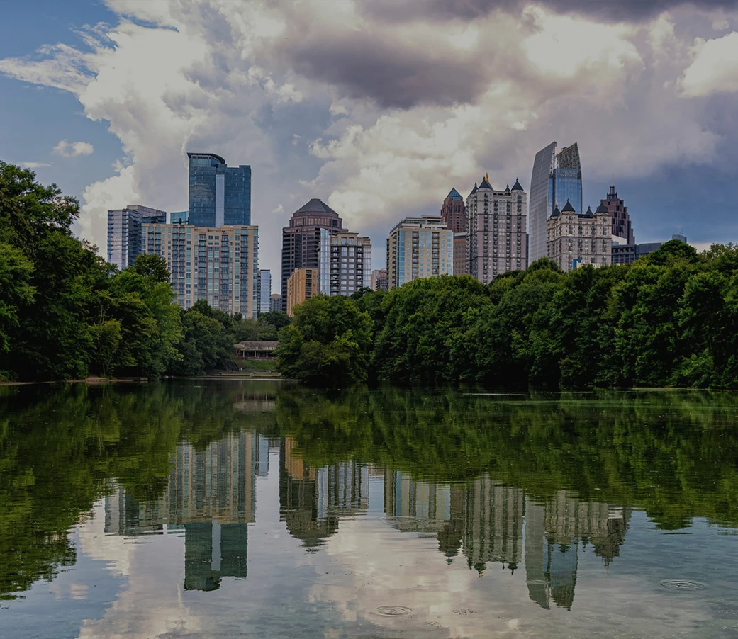 Piedmont Park skyline with trees and water