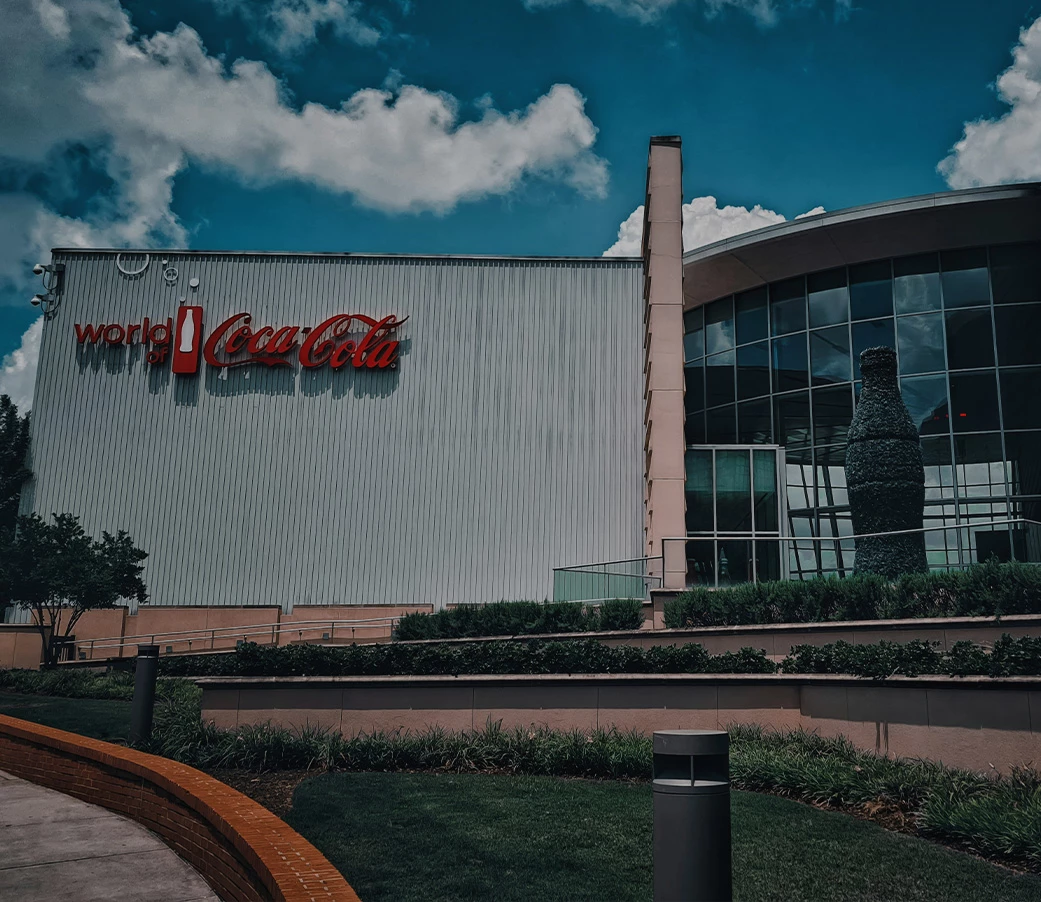 a building with a large glass wall and a large bottle